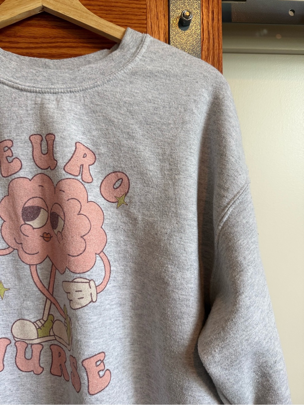 Gildan Gray Crewneck Sweatshirt with Pink Cartoon Brain Graphic